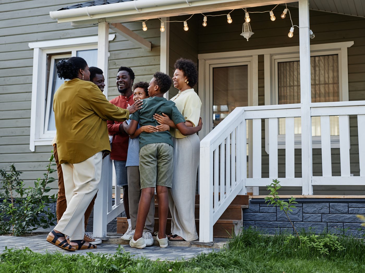 A family together outside their new home
